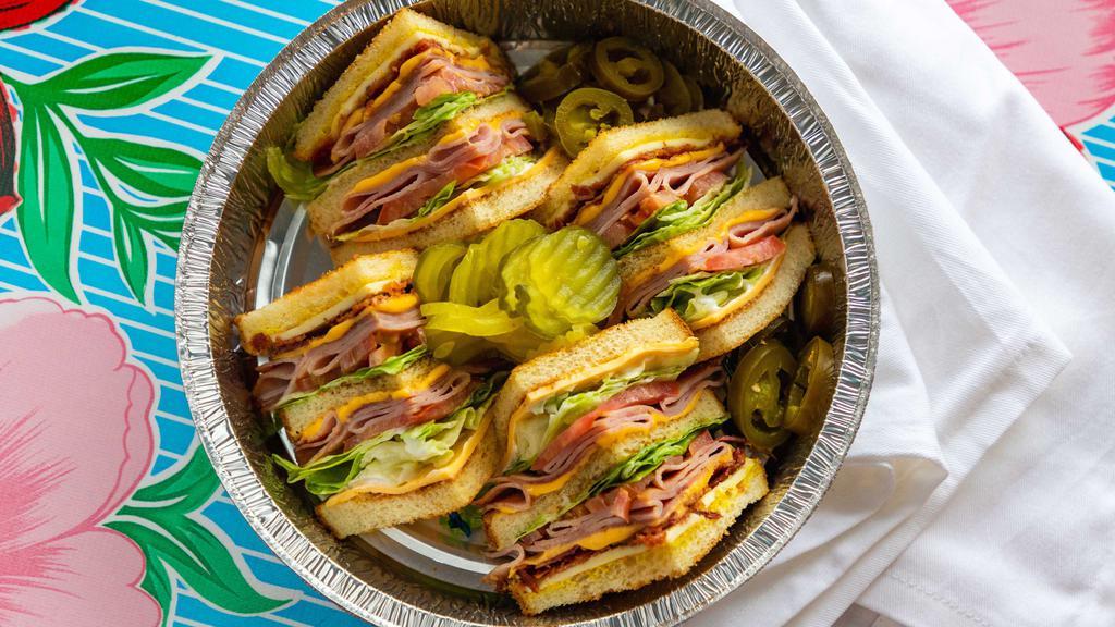 El Club Mexicano Sandwich · Two layers of classic style buttered-toasted bread and grilled ham, bacon, lettuce, tomato, mustard, mayo, swiss and cheddar cheese.