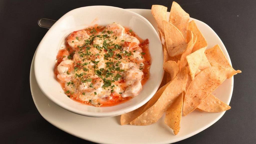 Shrimp Rangoon Dip · velvety mixture of cream cheese and shrimp with a hint of Ginger, finished with a Sweet Chili drizzle, fresh Cilantro and Toasted Panko served with seasoned tortilla chips