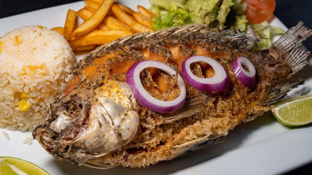 Mojarra Frita · Fried whole tilapia. Served with rice, guacamole, fries and salad.