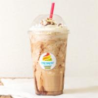 Frappé (Iced Coffee) · 16 oz. Delicious coffee ice cream mixed with ice and chocolate with whipped cream on top.