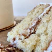 Italian Cream Slice · Coconut cake frosted and filled with cream cheese buttercream, filled and topped with crushe...