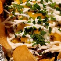 Papa Asada · **NEW ITEM** Large Baked Potatoe Loaded with Butter, Cheese, Carne Asada,  Sour Creme,Green ...