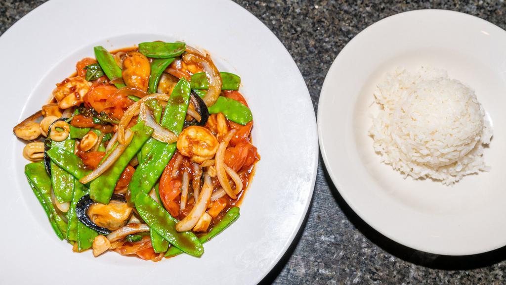 Seafood Combo · Mussel, squid, scallop, shrimp, onion, snowpea, tomato, fried basil in three flavor sauce.