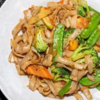 Pad Kee-Mow  (L) · Flat noodle stir with mushroom, bell pepper, onion, tomato, green bean, and basil spicy chil...