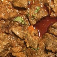 Lamb Curry House Special · Boneless lamb cooked in a spicy onion, ginger, and garlic sauce. Served with rice.