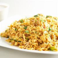 Vegetable Biryani · Basmati rice cooked with spicy curried vegetables, nuts, and a hint of mint.