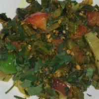 Bhindi Masala · Okra sautéed with onions, tomatoes, and spices.