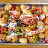 Loaded Fries · Queso, bacon, flaming hot cheetos, ranch and jalapeño.