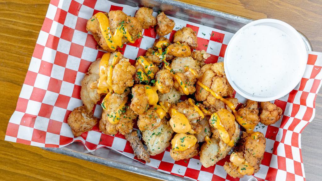 Cauliflower Wings · Pickled cauliflower florets, comeback sauce, cajun served with a side of ranch