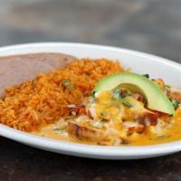 Pollo Con Queso · Sliced chicken breast topped with pico de gallo, chile con queso and melted blended cheeses....