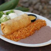 Chimichanga · A deep-fried flour tortilla filled with shredded chicken. Served with Spanish rice, refried ...