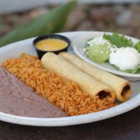 Flautas De Pollo · Two lightly fried flour tortillas filled with shredded chicken. Served with guacamole, sour ...