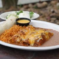 Monterrey Dinner · A fajita taco, a tamale, one beef, and one cheese enchilada topped with chili gravy. Served ...