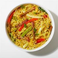 Singapore Style Rice Noodles · Stir fried rice vermicelli noodles seasoned with curry powder and tossed with vegetables.
