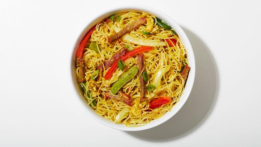 Singapore Style Rice Noodles · Stir fried rice vermicelli noodles seasoned with curry powder and tossed with vegetables.