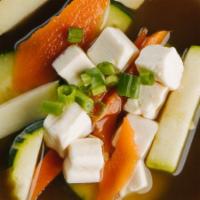 Miso Soup · Soy bean paste broth, zucchini, carrots, soft tofu and green onions.