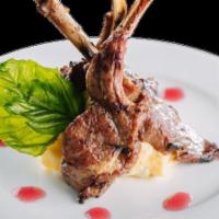 Lamb Chops · Lightly medium grilled served with red wine sauce and mashed potatoes.