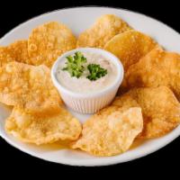 Crab Ragoon Dip · Minced crab meat in cream cheese served with Asian chips.