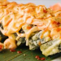 Crab Meat Dynamite Roll · Crawfish, crab stick, avocado, cucumber, fried tempura style topped with layer of baked craw...