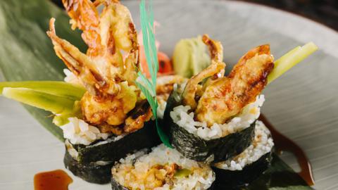 Spider Roll · Tempura soft shell crab, radish sprout, green leaf, cucumber, avocado and eel sauce.