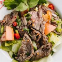 Beef Salad · Grilled  steak, fresh tomatoes, cucumber, fresh lettuce, onion and cilantro with spicy lime ...