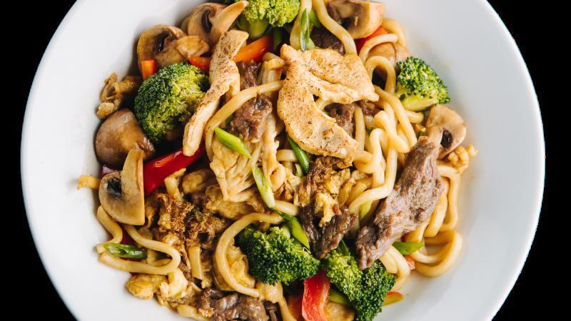 Udon Noodle · Stir fried udon noodle with eggs, green onion, broccoli, bell pepper and mushroom.