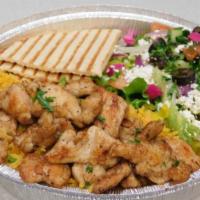 Shawarma Chicken Plate · Served with rice, salad, hummus, pita bread and garlic sauce.