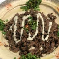 Hummus With Meat · Beef or Chicken shawarma on Hummus plate comes with pita bread.