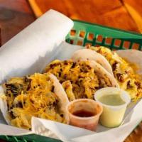 Classic Breakfast Taco · Breakfast tacos come with egg, cheese, and your choice of meat.  Includes Salsa on the side.