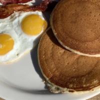 Pancake Breakfast · Two pancakes served with bacon or sausage and toast.