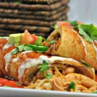 Ground Beef Chimichanga · Stuffed with rice an beef deep fried  and  cover ed with  ranchero sauce  served  with  refr...