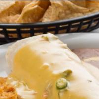 Ground Beef Burrito · Covered  w queso sauce  served with rice.