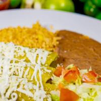 Enchiladas Verdes · Chicken enchilada covered with tomatillo topped with sour cream and queso fresco. Served wit...