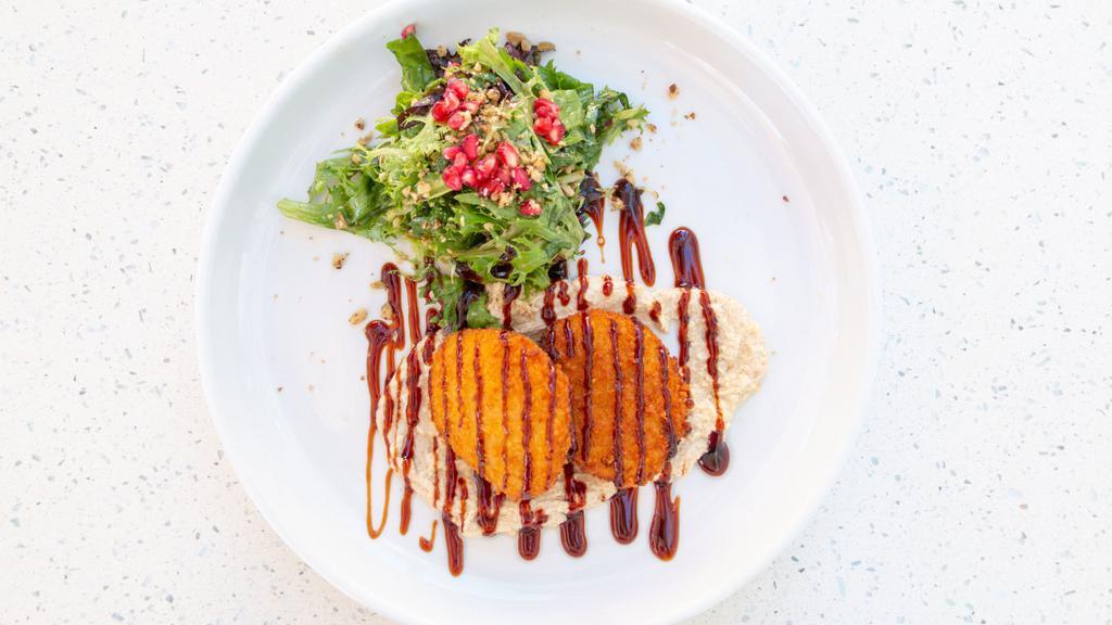 Fried Goat Cheese · Pistachio-crusted goat cheese, pomegranate green olive salad, tahini sauce.