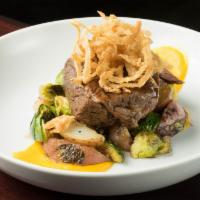 Braised Beef Short Ribs · Roasted potatoes, carrot puree, cigar onion, Brussel sprouts.