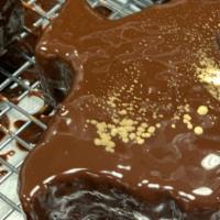 Texas Shaped Chocolate Cake · Chocolate genoise dusted with gold.