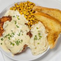 Chicken Fried Chicken · Ranch battered fried chicken breast topped with peppered gravy, served with roasted corn and...