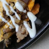 Small Volcano Fries · Melted cheddar cheese on the top of a 1/2 crinkle cut fries, seasoned ground beef, jalapeno'...