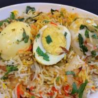 Egg Biriyani · Eggs cooked with basmati rice and aromatic whole spices on a slow fire.