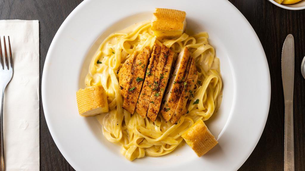 Cajun Chicken Pasta · Choice of grilled or fried chicken strips with fettuccine pasta and spicy alfredo sauce.