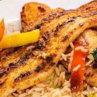 Blackened Fish Stir-Fry · Sauteed in olive oil with Cajun spices and fresh cut vegetables, served over rice.