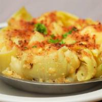 Artichoke Hearts · Artichoke Hearts Baked with Homemade Italian Breadcrumbs in Campisi’s Special Butter Sauce