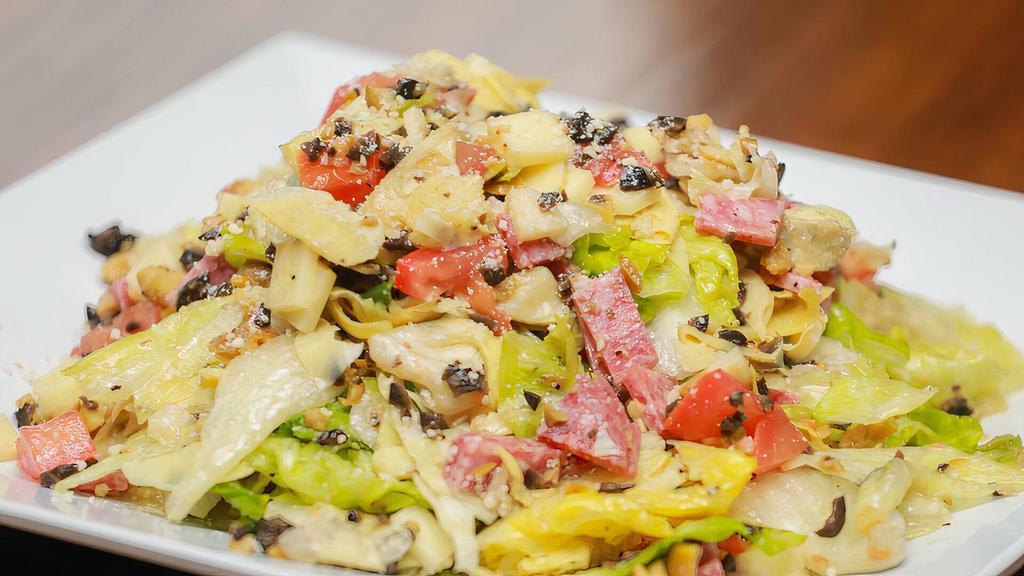 Chopped Salad · Diced Salami, Provolone, Black and Green Olives, Tomatoes, Artichoke Hearts Tossed with Lettuce and our Italian Dressing