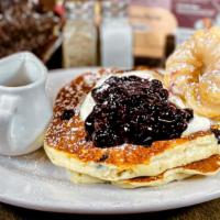 Blueberry Cheesecake Pancakes · 2 homemade blueberry pancakes garnished with cheesecake batter, blueberry compote & a French...