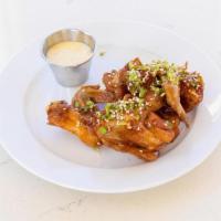 Sticky Chicken Wings [Gf] · eight crispy chicken wings tossed in house-made honey garlic spicy sticky sauce; garnished w...