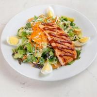 Atlantic Salmon Salad · mixed greens, romaine, shaved carrots, croutons, boiled eggs, & queso fresco; tossed with ou...