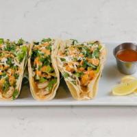 (3) Shrimp Tacos [Gf] · sautéed baby shrimp, shredded romaine lettuce, capers, pico de gallo, cilantro, roasted pepp...