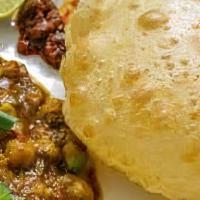 Cholé Bhaturé (1 Pc) · Combination of chickpeas curry and fried bread made from all-purpose flour.