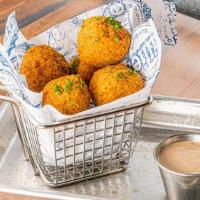 Mac & Cheese Brisket Balls · Stuffed with mac & cheese, smoked brisket, cheddar, and fried to perfection. Served with BBQ...