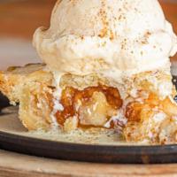 Apple Sizzler · Apple pie with brandy butter sauce and vanilla ice cream on the side.